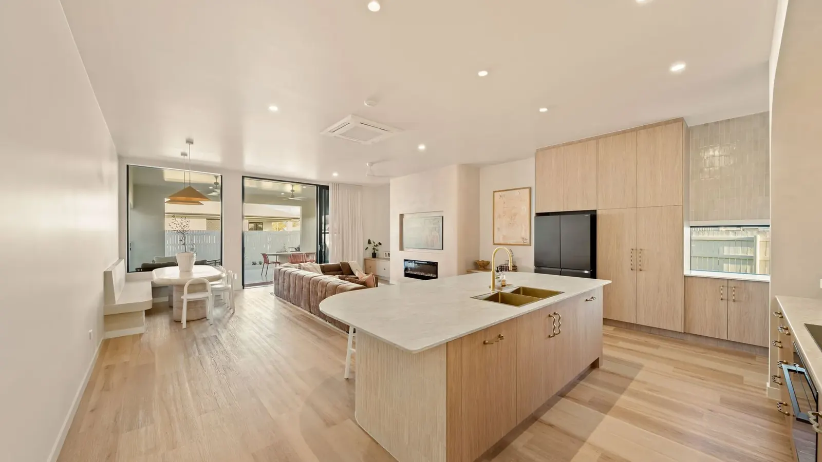 Kitchen at Sunnymount House, sculptural island and arched joinery recesses