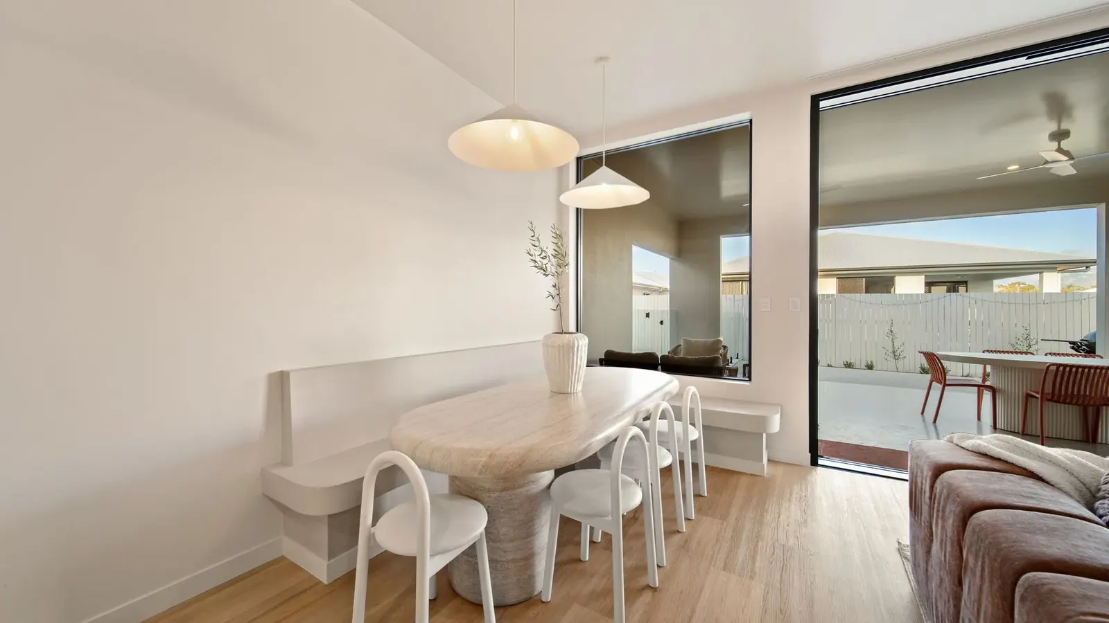 Living and dining opening to the outdoor entertaining area at Sunnymount House