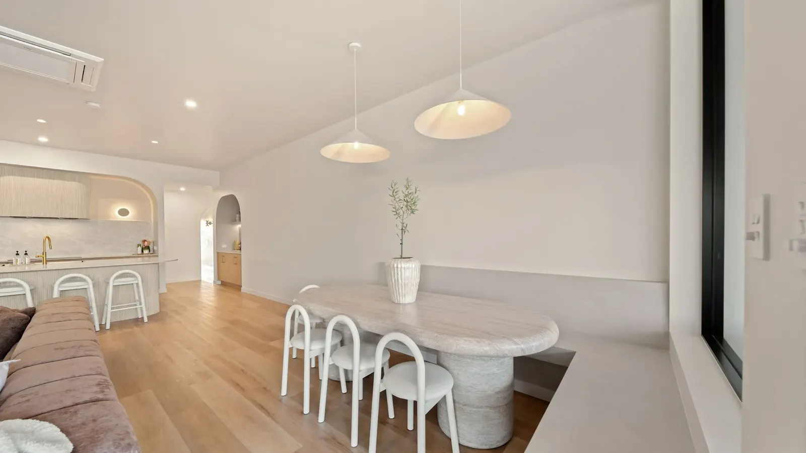 Living and dining opening to the outdoor entertaining area at Sunnymount House