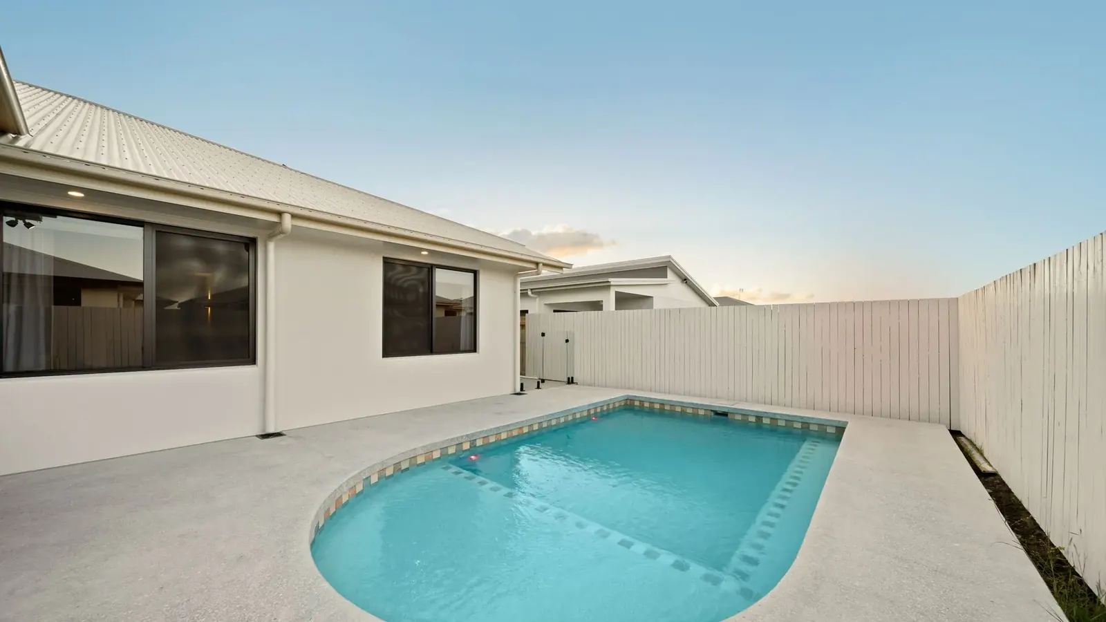 Pool and paved entertaining area at the rear of Sunnymount House